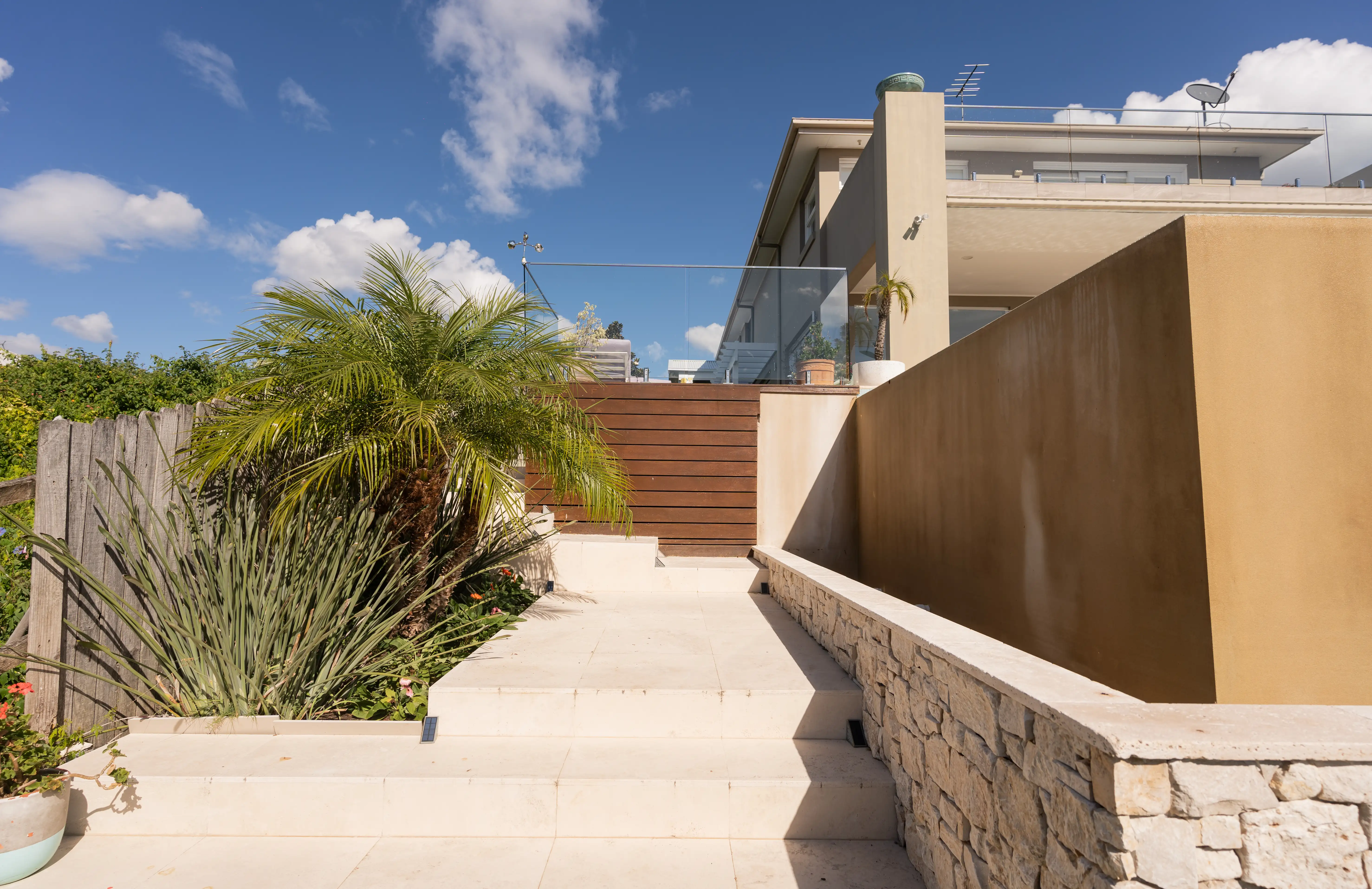 Timber or composite decking integrated with a pergola structure